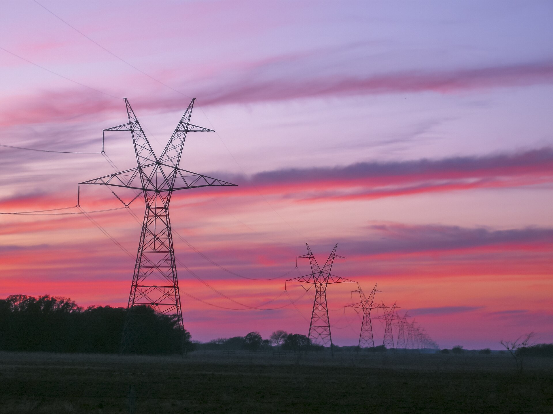 High-voltage transmission towers and lines at sunset in East Texas (file photo).